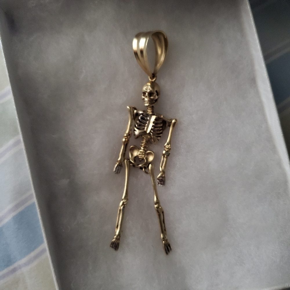 Skeleton gold pendant
